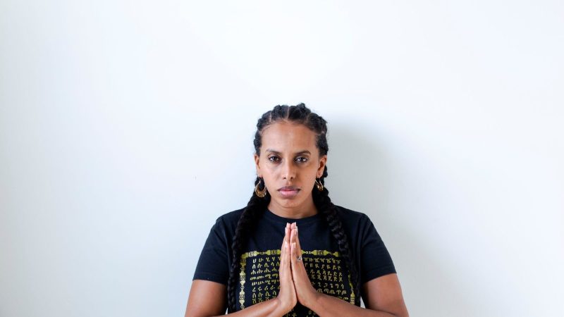 A woman praying with folded hands