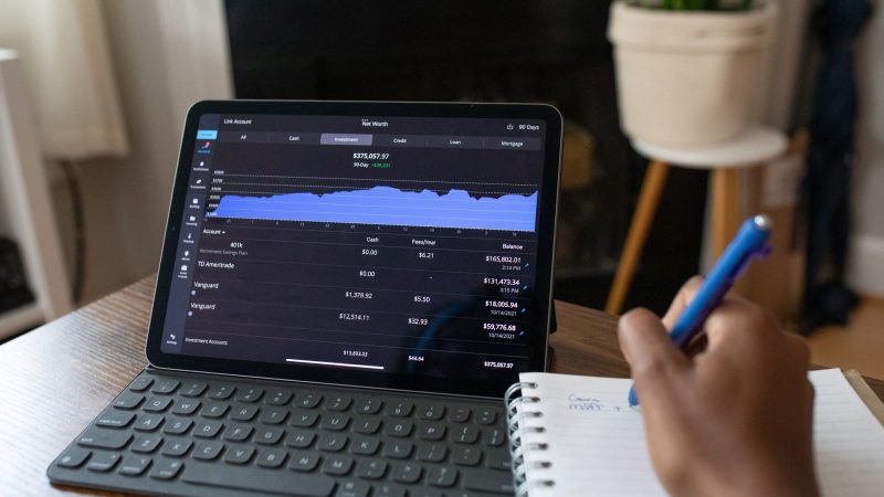 Planning a budget with a tablet and notebook